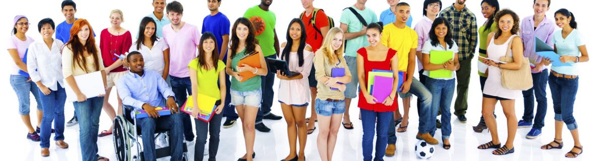 Many young people standing and sitting in a crowd