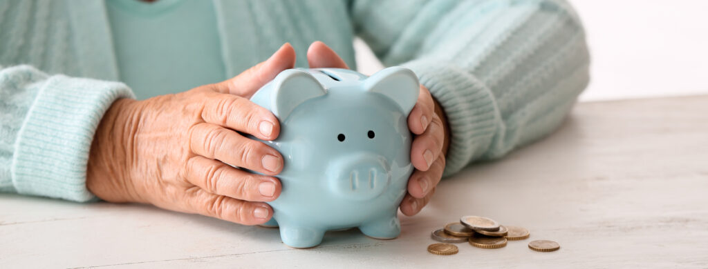 Hands holding a piggy bank